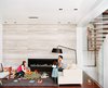 When the Hsus found themselves expecting a third child, they engaged Lang to enclose the upper part of their double-height living room to create a fourth bedroom and playroom-study upstairs. Additionally, Lang resurfaced the fireplace wall with massive slabs of filled silver travertine marble. The slabs were so large that one of them broke an adjoining floor-to-ceiling glass pane during installation. Photo of Versatile Uses For Travertine modern home