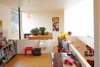 The upstairs loft is an office-cum-craft room. Evidence of the family’s DIY nature is omnipresent. Hale built a planter box and art-supply cubbies with leftover plywood. The space is equipped with plumbing hookups in case—or more likely, when—the family chooses to convert the area into a third bedroom and bathroom.