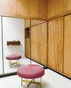Xenia’s dressing room was much larger than Irwin’s and had a custom stool covered in Girard’s Mogul 081 fabric. A few pieces of Xenia’s extensive blue opaline glass collection sit on her dressing table. Photo 7 of Miller House in Columbus, Indiana by Eero Saarinen modern home