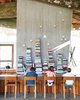 Modern home with Dining Room, Table, Concrete Floor, and Chair. Impromptu reading time in the open-plan kitchen is encouraged. Photo 7 of 23.2 House