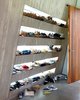 Modern home with Storage Room and Shelves Storage Type. Just off an internal courtyard, a mudroom provides a prime place to keep sneakers. Each family member has their own shelf, backlit by windows that illuminate every pair. Photo 10 of 23.2 House