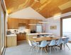Rendely gave in and incorporated a more traditional gable roof but inside the house, which has been dubbed The Farm, it's all modern. Around the cherry dining room table are ten Eames shell chairs. Photo 2 of The Farm modern home