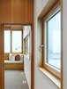 The second floor features the master bedroom and bathroom. From certain spots in the house—and on clear days—Lake Ontario can be seen in the distance (five miles away). Photo 5 of The Farm modern home