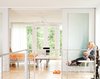 Modern home with Doors, Sliding Door Type, Interior, and Wood. Sleek frosted glass sliding doors partition off the back sleeping loft for privacy without impeding light. They also lend the space an ethereal demeanor, which is echoed in the translucent curtains made of parachute fabric from ParaGear. Photo of Designing for Privacy: 14 Discreet Uses For Frosted Glass