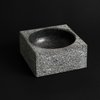 Poul Kjærholm originally designed this granite bowl as a 550-pound ashtray for the city hall in Fredericia, Denmark. This smaller version, which weighs 6.5 pounds, can be used for holding everything from fruit to business cards to jewelry. Photo of Architectmade modern home