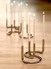 Peter Karpf's modular candleholder can be arranged in what seems like infinite combinations. The U-shape Gemini holds two candles and stands elegantly on its own or in a group, as shown here. Photo of Architectmade modern home