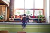 Modern home with Kitchen and Colorful Cabinet. Kids’ Lit
To display the children’s artwork in a fun and flexible way, John designed a four-foot-high lightbox, custom-built by Geron, and installed it above the staircase. The front panel is non-glare acrylic held in place with magnetic strips; low-voltage LED strips provide the backlighting. “We’ll change out the art at least at every holiday and birthday,” says John.
geron.ca Photo of Tips for a Pain-Free Kitchen Renovation