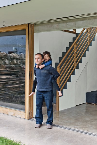 Gaffney and Kiku take in the air from the large sliding door bought from Timber Tech Scotland.