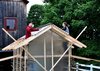 Pictured here are two of the students at work on the Chicken Chapel. "They were great," Moskow says. "It'd be sunny in the morning then there'd be a rainstorm in the afternoon, but no one complained. It took really, really long days to finish it but they were gung-ho to get it done and were very proud of it at the end." Photo of Chicken Chapel modern home