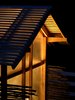 The entire structure takes on the look of a Japanese lantern in the evening. The team added lights so you could go in and be able to see where you are at night and also so that come late fall and winter, Moskow can turn them on after the sun sets to maintain the chicken's waking, eating, and egg-laying hours even as the days shorten. Photo of Chicken Chapel modern home