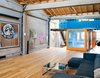 The shipping containers were stacked, joined with steel tubes, and lashed to reinforced floor joints to make them earthquake-safe. Photo of Amazing Examples of Shipping Container Architecture modern home