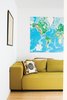 Modern home with Living Room, Sofa, and Light Hardwood Floor. A mustardy couch and a large map of the world—Whitlock travels all over the place for work—keep the living room bright and cheerful. Photo of How to Design With Maps