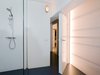 The bathroom is tucked inside the lightbox on the second level. Photo 7 of Parksite Residence, Rotterdam modern home