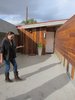Beckmann stands in front of one of the four Lautner-designed units, each of which opens onto the concrete walkway and have a private entrance and private patio (set behind the redwood fence to the left). Photo of A John Lautner-Designed Hotel modern home