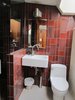 All the bathrooms are tiled with Heath Ceramics seconds in rich hues. Opting for an approach of adaptive reuse over strict preservation, Beckmann and Trowbridge ripped out the dated pedestal sinks and cast-iron tubs and replaced them with modern wall-mounted sinks and spacious walk-in showers. Photo of A John Lautner-Designed Hotel modern home