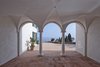 The remodel involved restoring the concrete ceilings, parapets, terrace stairs, and pergolas, down to each vault, arch, and corbel. The grandiose Baroque balustrades had to be replaced by filigree post banisters. Photo of A Renovated Modernist Oasis in the French Riviera That Has Hosted Picasso and Royalty modern home
