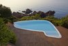 Modern home with Outdoor, Large Pools, Tubs, Shower, Large Patio, Porch, Deck, and Wood Patio, Porch, Deck. The swimming pool was reshaped and refinished to blur the transition between deck and rocky outcrop. Beyond the pool is the villa’s private beach, framed by lush vegetation. Photo of A Renovated Modernist Oasis in the French Riviera That Has Hosted Picasso and Royalty