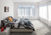 Modern home with Bedroom and Bed. In the master bedroom, a Mandal bed from Ikea is draped with a Tuuli duvet cover by Marimekko. Photo of Our Favorite Bedrooms