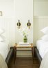 Vermont manufacturer Conant Lighting produced the wall sconces, which are ASH's desing, next to each bed. Photo 10 of The Dean Hotel in Providence modern home
