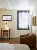 ASH reused the original flooring in the building and spot-matched new wood to fill in the gaps. Photo 12 of The Dean Hotel in Providence modern home