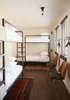 Hostel-style bunks are available in the hotel. "We liked the idea of creating a democratic hotel, where members of a band playing down the street or a student coming to visit RISD would feel as comfortable as the parent of a Brown student accustomed to luxury digs," Heckman says. "The idea of these different characters with different budgets rubbing shoulders in the hallways and lobby is very exciting to us." Photo 13 of The Dean Hotel in Providence modern home