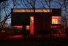The glowing home defines its environment as much as it responds to it. Its T-shape reduces the size of its footprint, thus sparing two timeworn trees and minimizing foundation costs - a real concern when building on Arkansas's notoriously unstable soil. Photo of This Illuminated Arkansas Home Changes Colors with the Tap of a Smartphone modern home