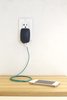 The charger is about 3 inches tall, 2 inches wide, and an inch thick, which makes it larger than almost any wall outlet-to-USB plug you'll see, but the design is meant to distinguish it from other wall chargers.The triangle pattern on the device has an outstanding single LED that is orange while charging, green when the device is charged, and off when it's drawing no power. Photo of Eco-Friendly Device Charges Your Phone and Shuts Off When It's Done modern home