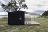 Modern home with Exterior, Prefab Building Type, Cabin Building Type, Shed Building Type, and Shed RoofLine. The homes are built on a concrete foundation and are typically constructed in only two days. Photo of Tiny Prefabricated House Can Be Built in Two Days