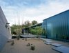 Modern home with Outdoor, Garden, Hardscapes, and Walkways. The home's exterior, composed of concrete and glass, welcomes guests with a traditional water fountain in the entryway. Photo by: Bill Timmerman Photo of Water Features We Love