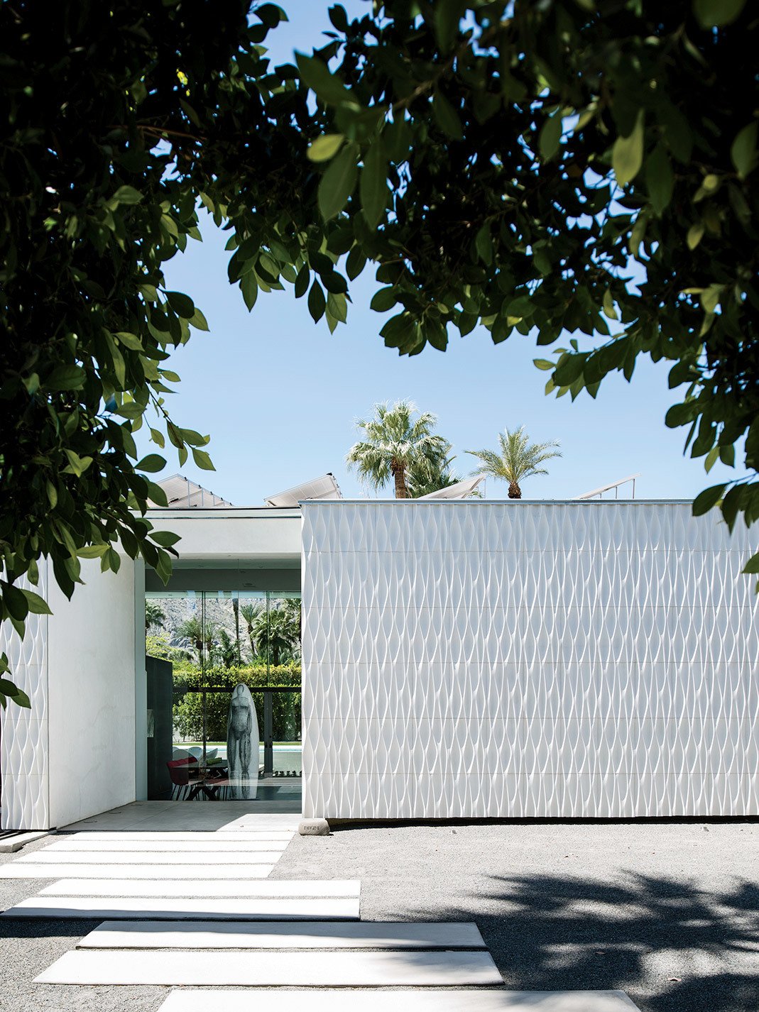 Exterior and House Building Type Configur8 tiles provide distinctive cladding for the exterior of this modern home.