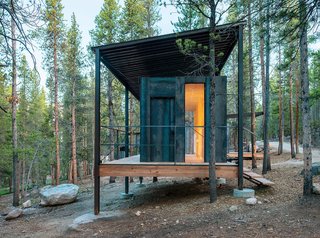 The Outward Bound cabins, designed by the University of Colorado Denver's design-build program, have steel frames that lift the structures above a three-foot snowpack while supporting corrugated-steel "snow roofs."