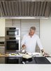 Modern home with Kitchen, Wall Oven, and Cooktops. Eric Ripert invited Dwell into his personal kitchen he co-designed with Poggenpohl and made us the perfect cod basquaise. Photo of Dwell Recipes for Modern Entertaining