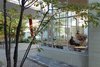 "It’s a true luxury to have a house with a garden in the middle of the city. That surely played a part in pushing for the conversion of the gas station into a home," he says. Photo 4 of An Incredible Home Inside a 1950s Gas Station modern home