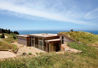 "I’ve been all around the world, and whenever I come back here, I realize that the Pacific Ocean seen from those cliffs is the most beautiful view on earth," says the resident of this house built into a hillside in Big Sur, California.