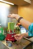 Whether it's a favorite wine or a memorable cocktail, a house drink makes for a powerful party ritual. Here Gabbert prepares a Southern California variation on the Bootleg, a drink that was a Gabbert family standard when they lived in Minnesota. Photo of Dwell Recipes for Modern Entertaining modern home