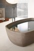 Modern home with Bath Room and Freestanding Tub. Inkstone bathtub, Sand Brown stone. Photo of Inky Inspiration