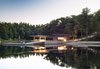 Modern home with Exterior, Boathouse Building Type, Wood Siding Material, and House. A bothouse in Georgian Bay, Ontario, by Weiss Architecture & Urbanism Ltd. is clad in black-stained resawn cedar. Photo of Stunning Waterfront Structures