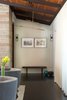 Sorenthia Lights by Studio Dunn hang in the entryway. Photo of Clean Update for a Midcentury House in Pennsylvania modern home