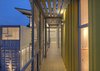 Modern home with Outdoor and Decking Patio, Porch, Deck. Trejos found that working with the containers was like playing with puzzle pieces. By arranging them in stacks of two and sliding the top containers, she created an interior courtyard and gallery space as well as terraces on the upper level. "Working with containers for the first time was a big challenge," she says, "but from the first draft on, it was an awesome experience. They already create space, so you just need to play with the puzzle pieces." Photo of Who Knew a Relaxing Tropical Retreat Could Be Made of Shipping Containers