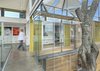 Modern home with Hallway and Concrete Floor. The stacked containers and inner courtyard, which wrap around a cedar tree, allow for plenty of natural sunlight, which helps illuminate the client's work on display in the main gallery space. Photo of Who Knew a Relaxing Tropical Retreat Could Be Made of Shipping Containers