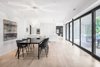 The addition was conceived as a "ribbon" that both hugs and runs lateral to the contours of the existing building, offering multiple vantage points from which to admire the surrounding landscape. Photo 3 of Prince-Philip Residence modern home