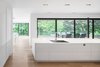 A view of the backyard through the kitchen. Photo 5 of Prince-Philip Residence modern home