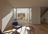 An additional seating area on the west side of the house makes for a cozy spot to enjoy a cocktail while taking in the afternoon sun. Photo 7 of Riverview modern home