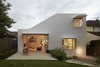 At the back of the house, the windows are sheltered by steel shades. Photo 9 of Riverview modern home