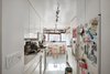 A before shot of the kitchen. Photo of Storage-Savvy Apartment Renovation in NYC modern home