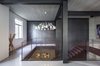 The architects describe the home as one that "emphasizes the difference and the tension between romantic historical design and an industrial approach." Photo 5 of Minimal Reboot modern home