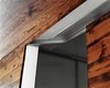 A close-up of the sliding door track shows the industrial detail of the recessed hardware. Photo 7 of New Grass Roots modern home