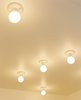 In the kitchen, compact fluorescent lightbulbs affixed to the ceiling are a simple solution. Photo 8 of New Grass Roots modern home