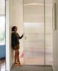 Modern home with Doors and Sliding Door Type. Pascal poses on the threshold of the living room, which can be closed off with a translucent pocket door, yet still take advantage of the light that pours in from all sides. Photo 20 of New Grass Roots
