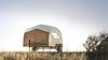 The jaunty boat-like shell of the Hütte Hut began with a case study undertaken by Brian and Katrina Manzo, a husband-and-wife team of industrial designers behind Sprouting Sprocket Studio. Photo of A 44-Square-Foot Prefab Trailer modern home